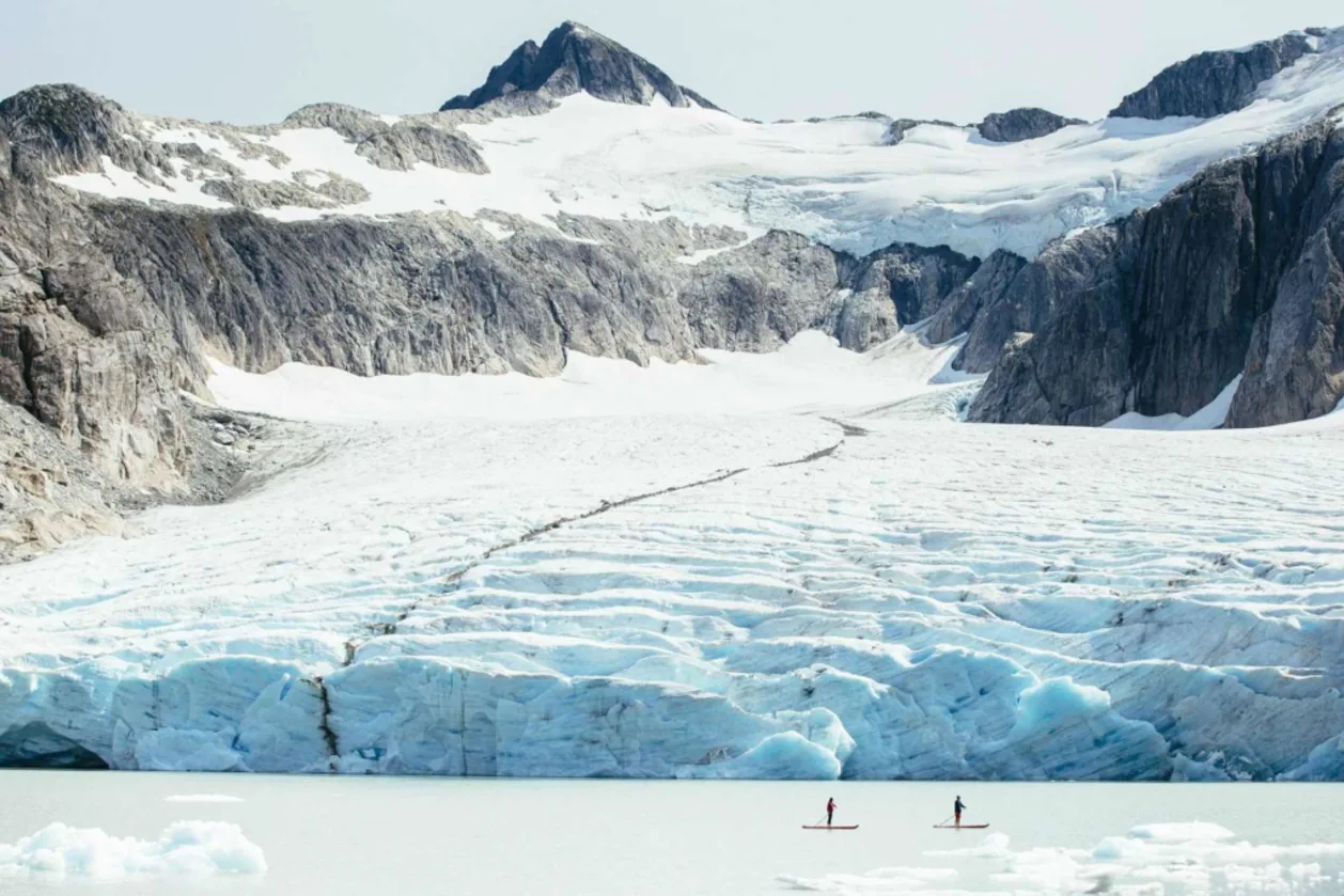 Two people SUPing at Nimmo Bay